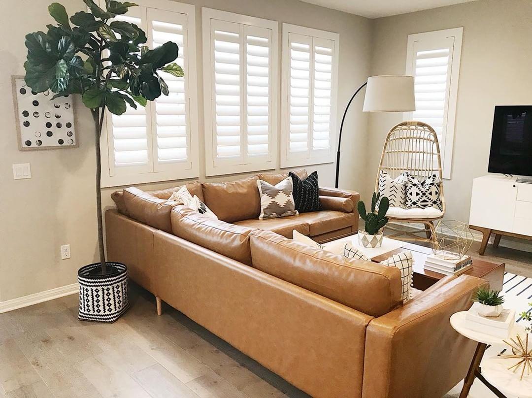 Warm living room with our Polywood shutters in Washington DC.